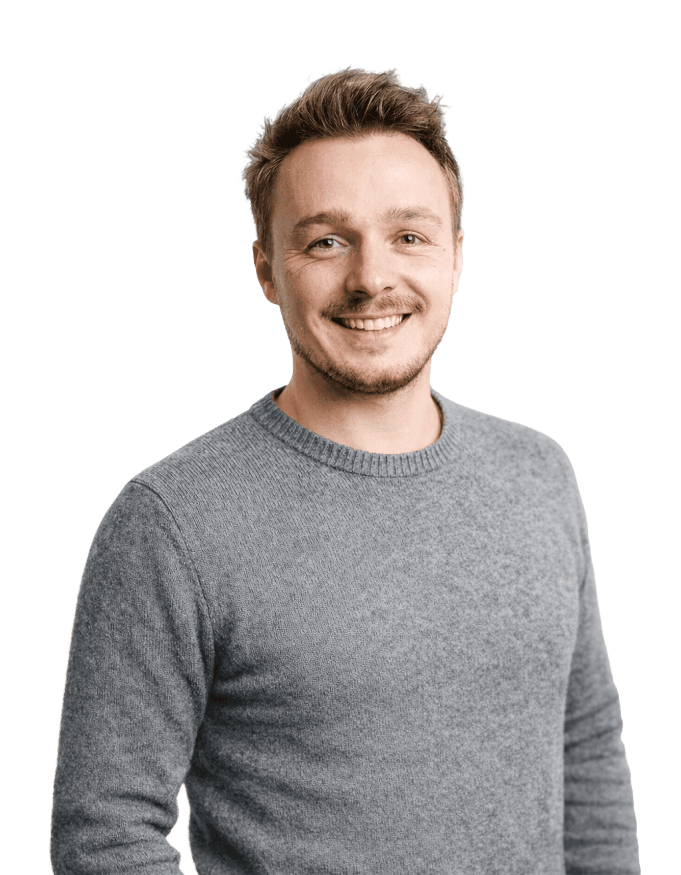 Smiling man with brown hair and a grey sweater, representing the Naboo team.