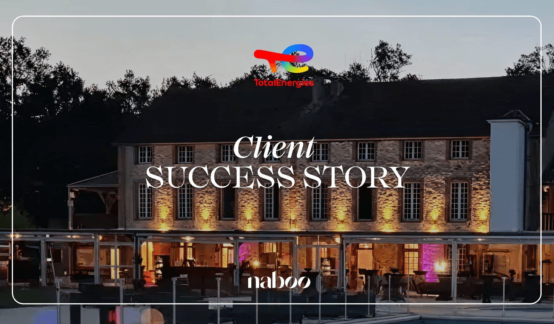 Historic stone corporate event venue illuminated at dusk