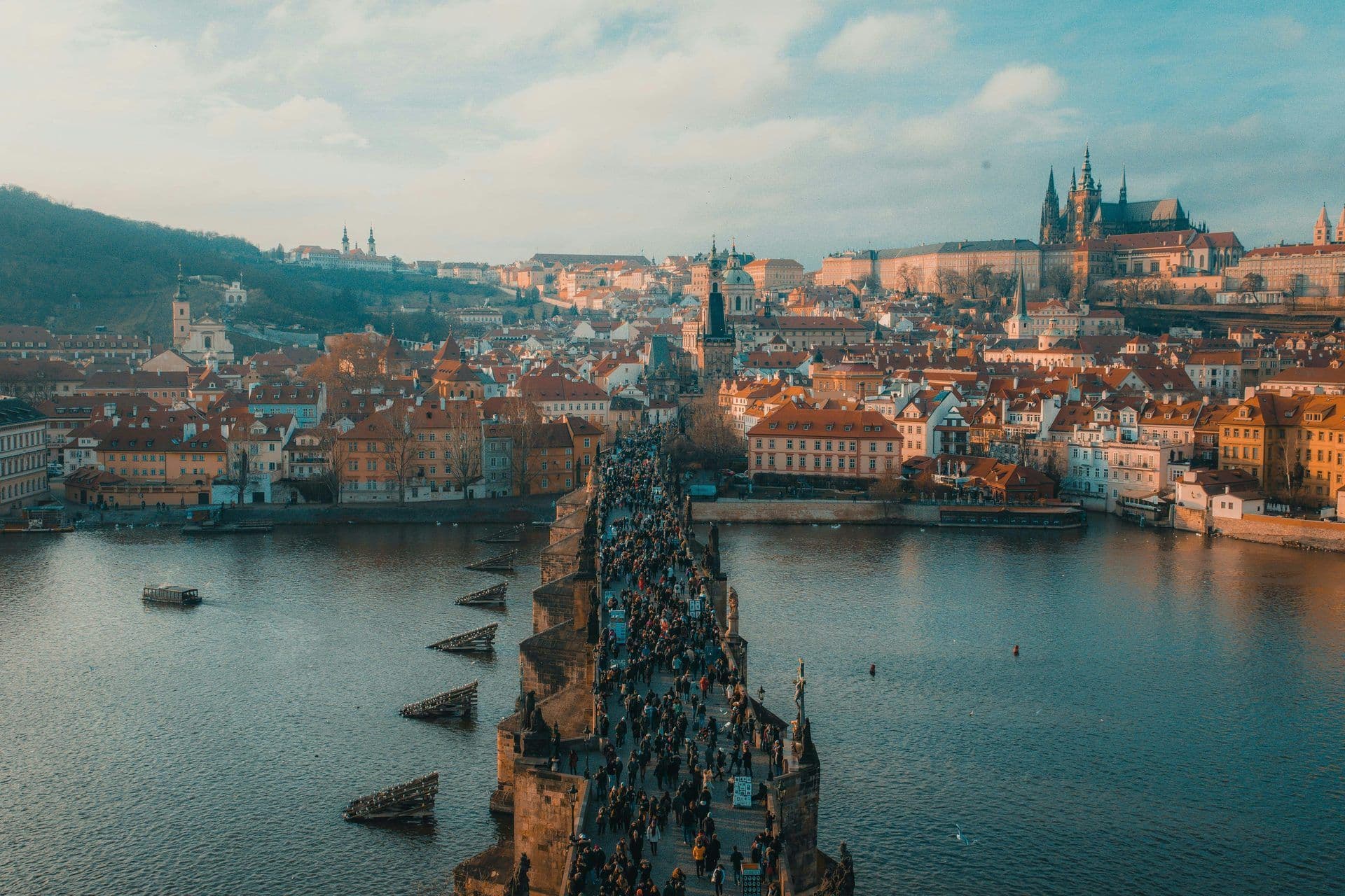 Historic Charles Bridge in Prague, Czech Republic, bustling with people