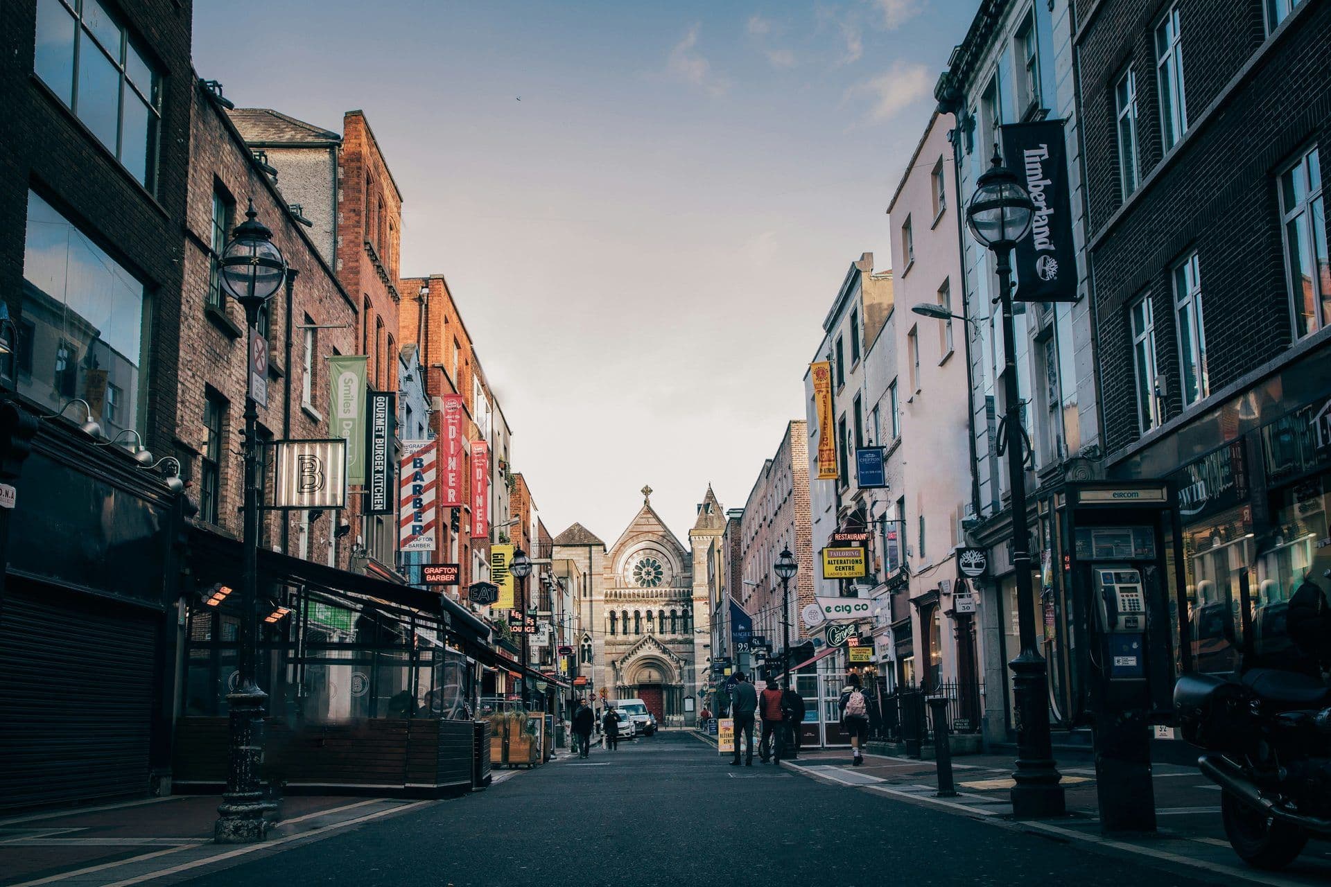 Grafton Street, Dublin, Ireland, lined with historic buildings, restaurants, and a landmark church.
