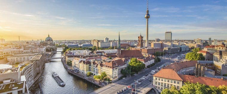 Berlin cityscape, a prime location for corporate events, featuring the Spree River and TV Tower.
