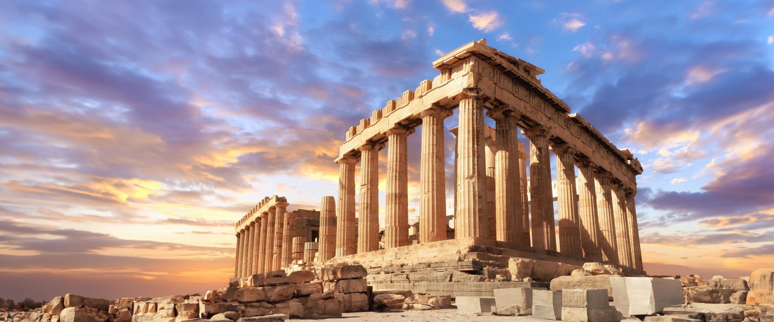 Historic Parthenon temple in Athens, Greece, a unique outdoor event space under a vibrant sunset sky.