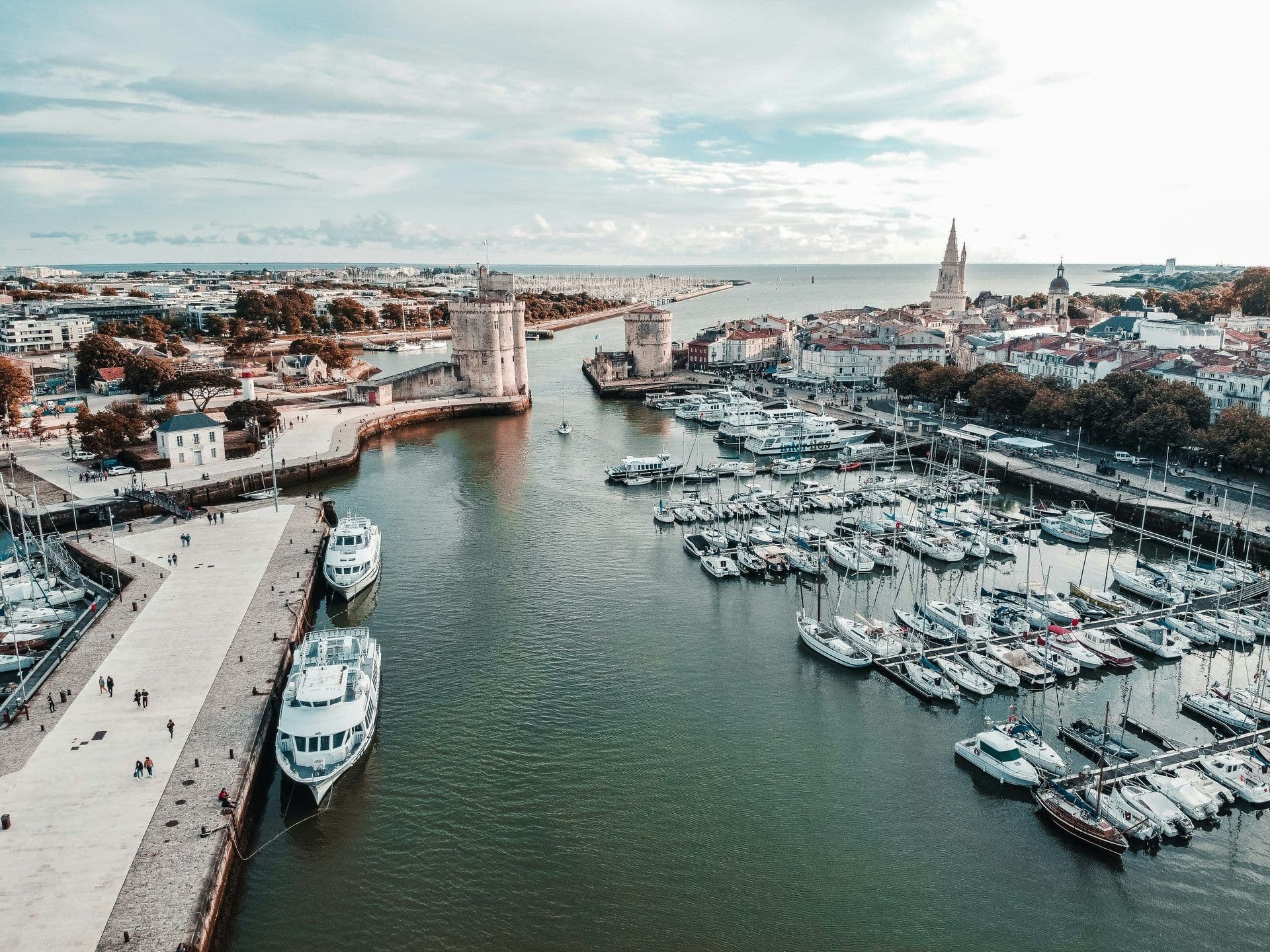 Aerial view of La Rochelle, France, showcasing a historic waterfront venue with a bustling marina.