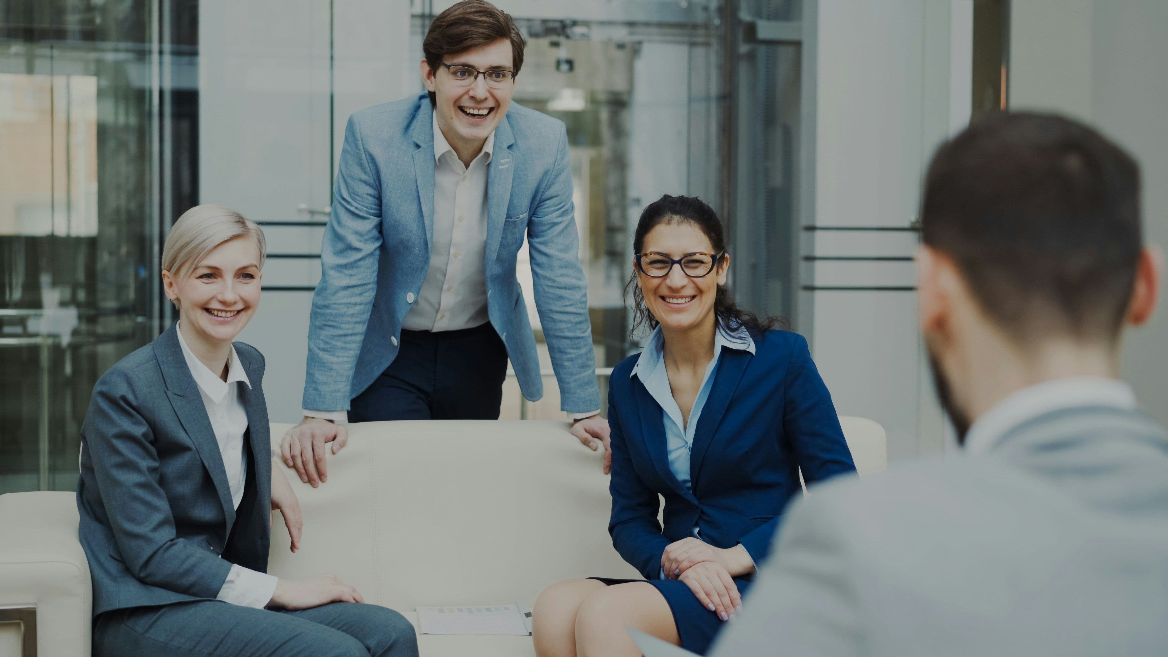 Group of diverse employees playing team building games indoors without equipment