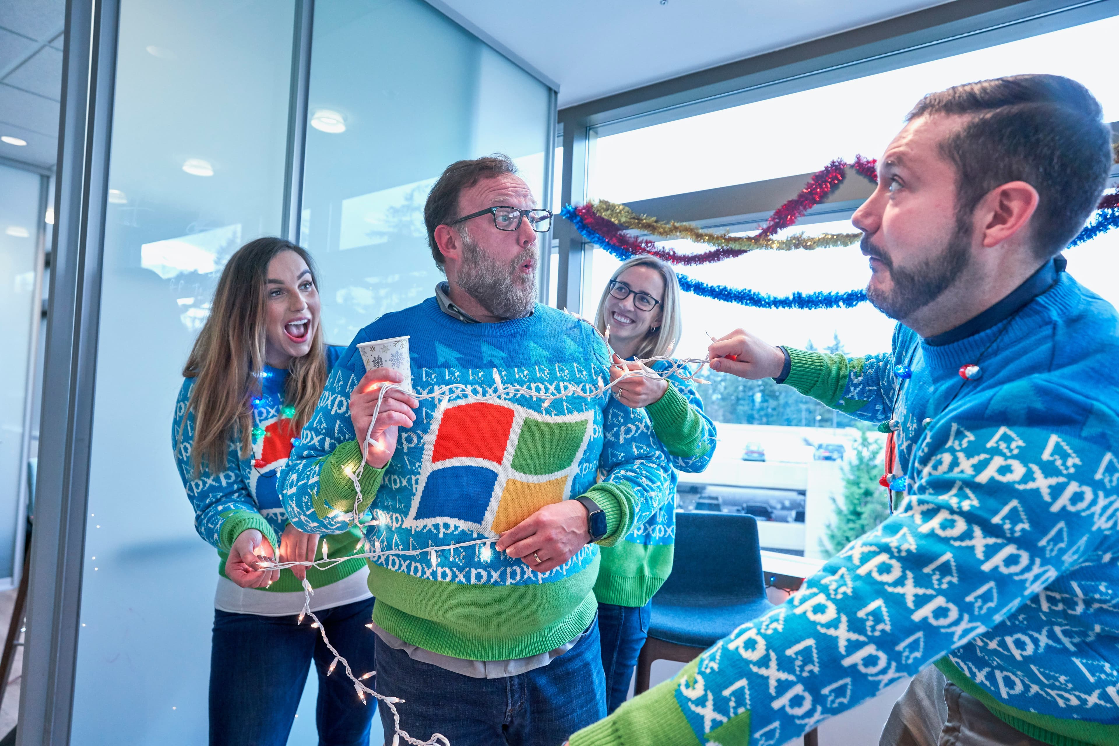 Colleagues wearing colorful costumes and themed outfits for workplace dress up day