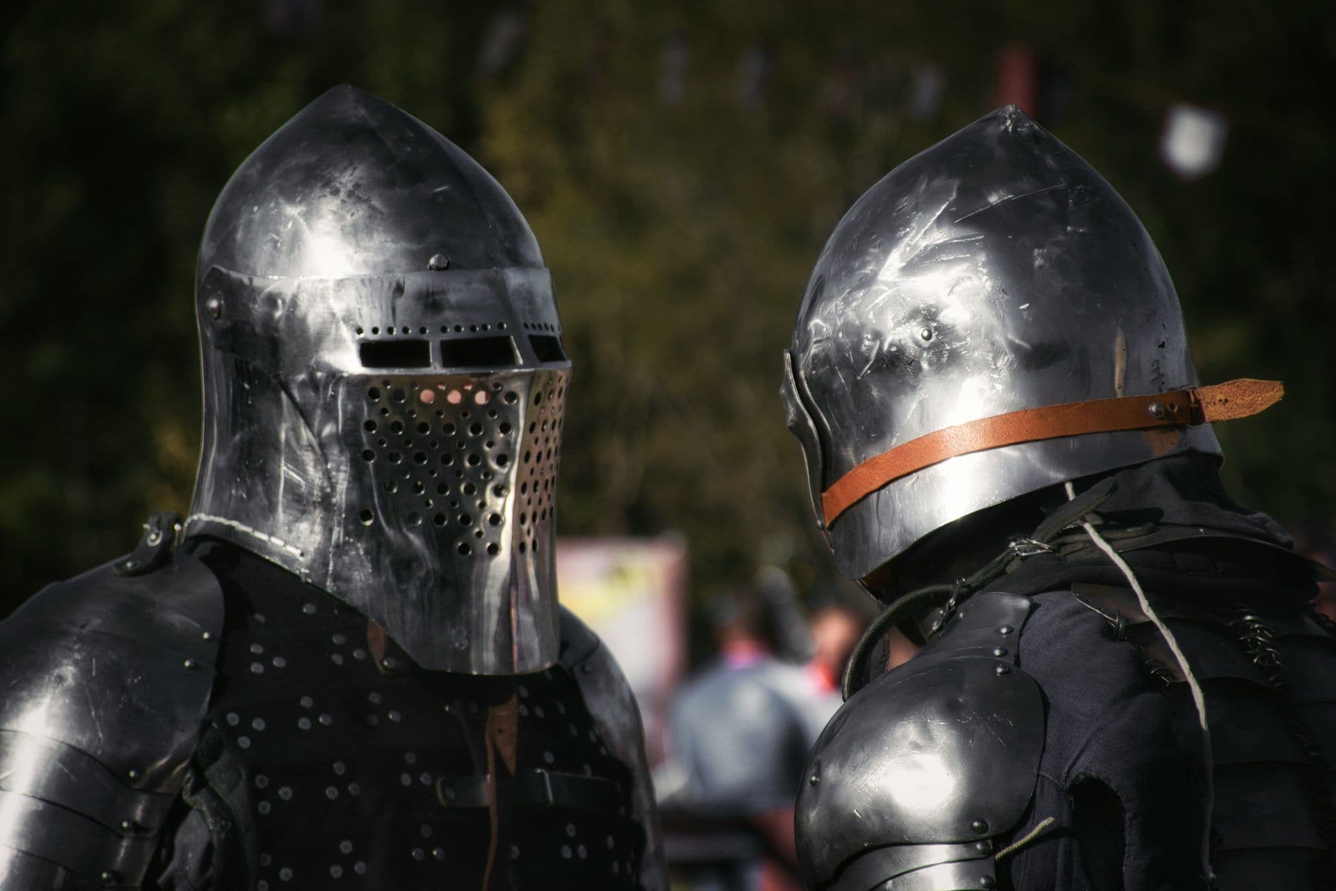 Two individuals in full medieval knight armor, ideal for a unique themed event or team building activity.