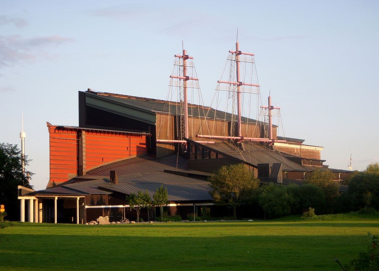 A unique corporate event venue in Stockholm, Sweden, with ship masts on its roof and a red and wooden facade.