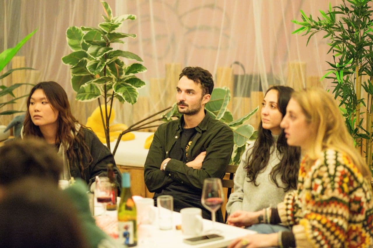 A diverse group of professionals participates in a corporate workshop