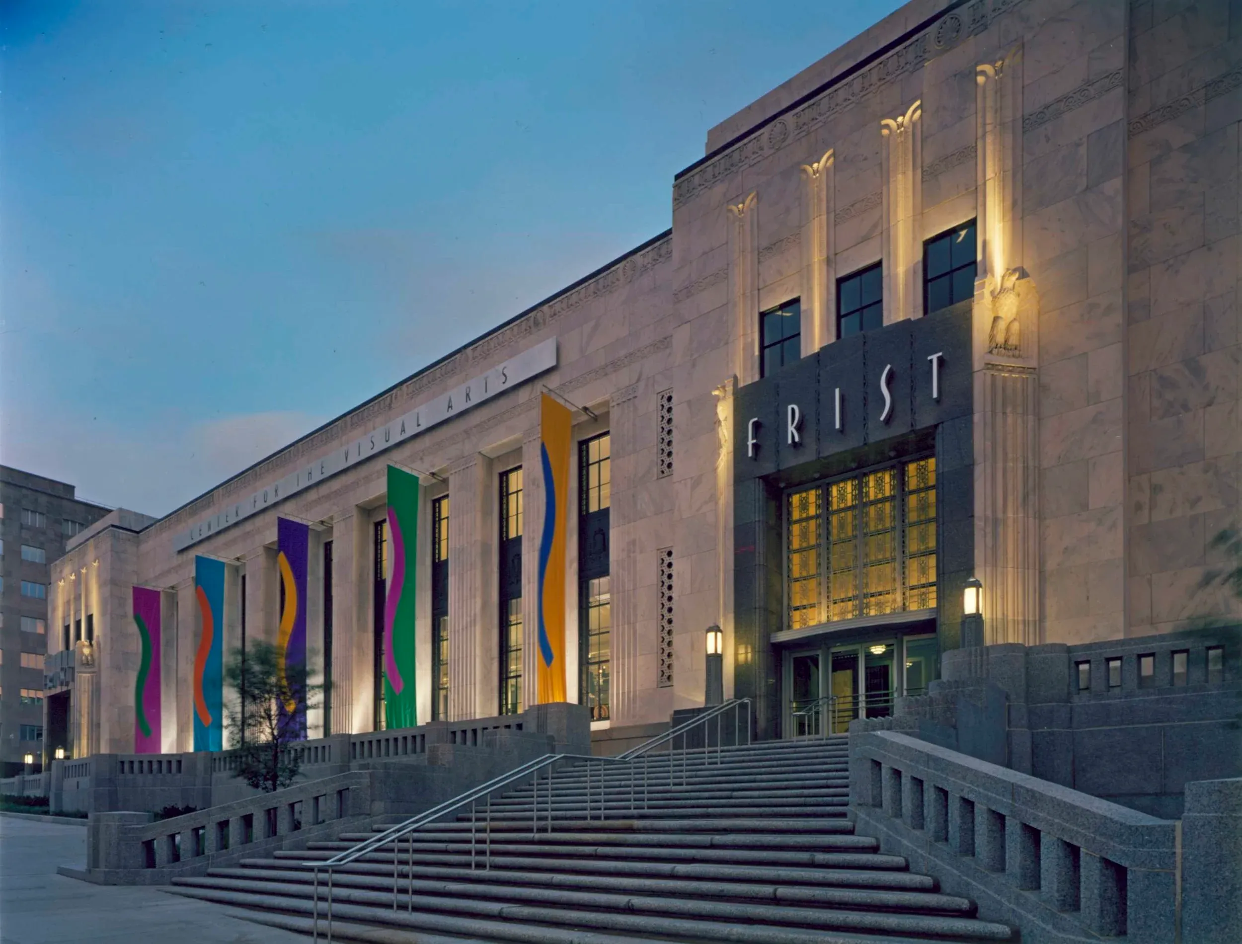 The Frist Art Museum, a historic Art Deco corporate event venue in Nashville, illuminated at dusk.