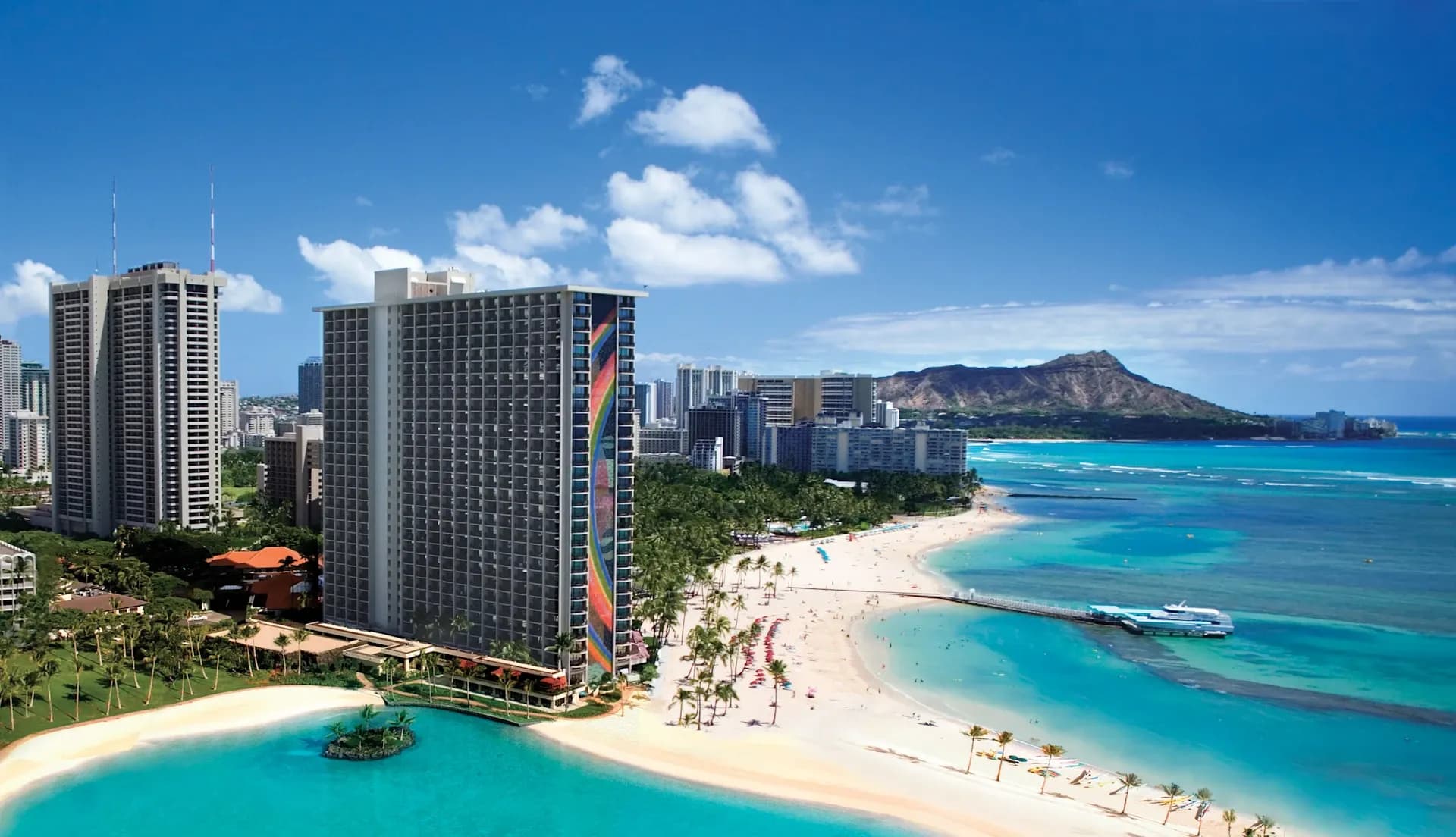 Aerial view of Hilton Hawaiian Village resort, Waikiki Beach, and Diamond Head in Honolulu, Hawaii.