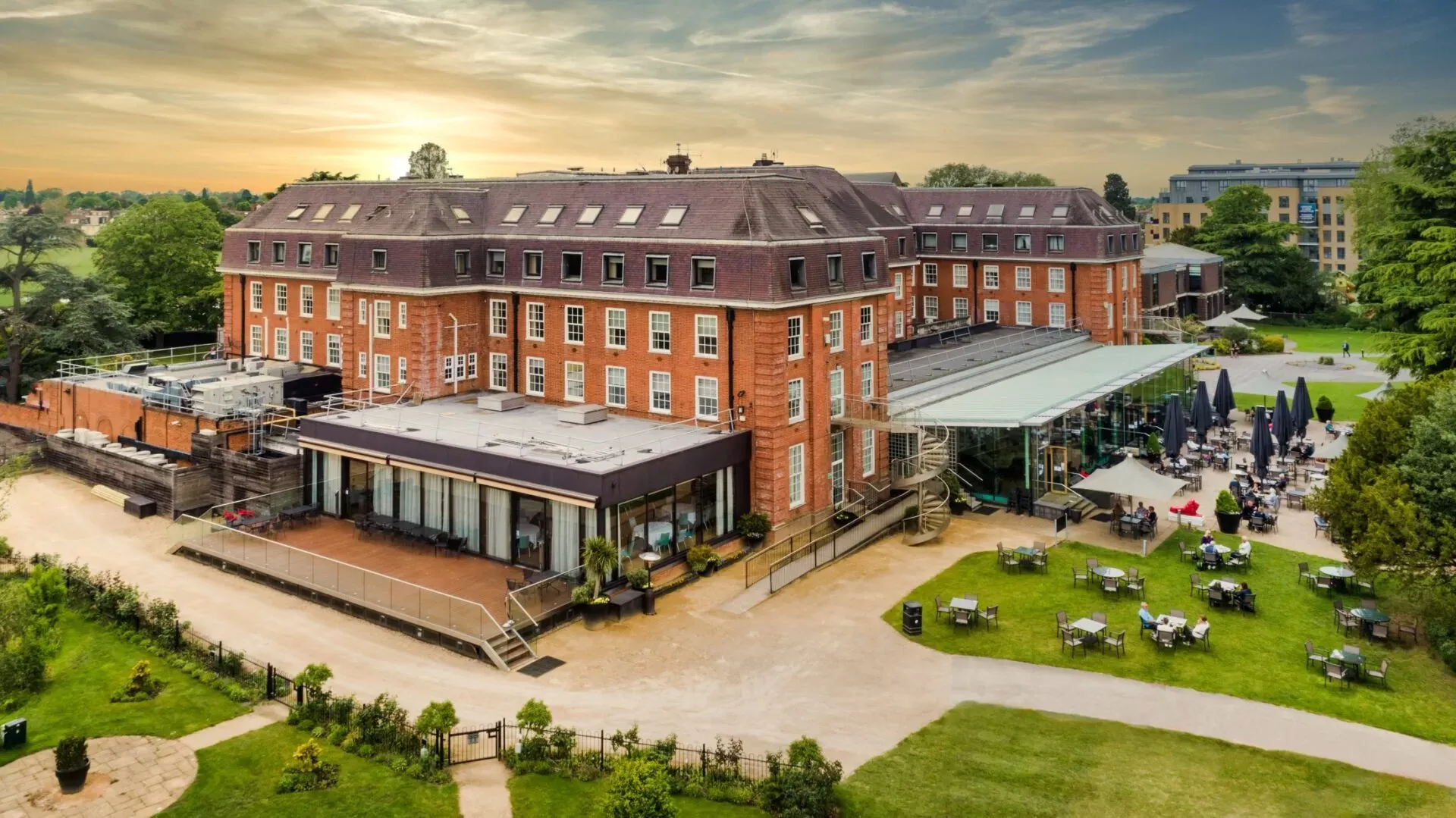 Aerial view of The Lensbury, a large brick corporate event venue in Teddington, London