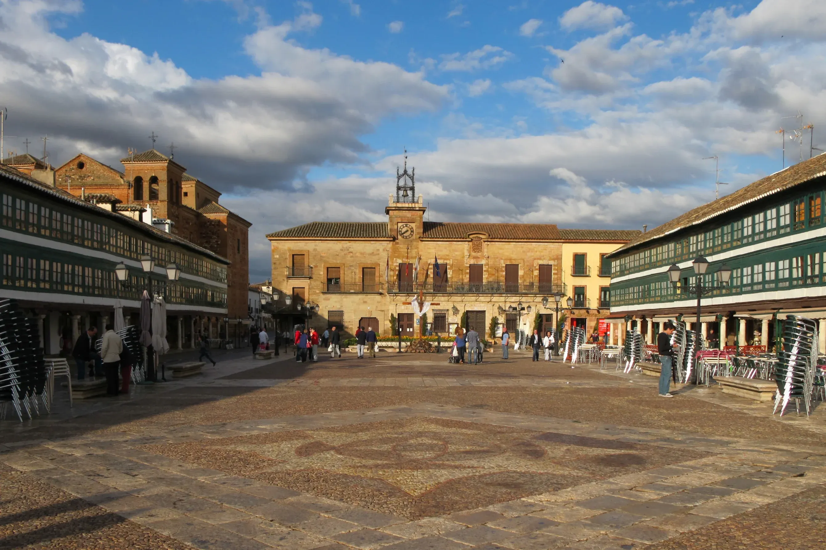 Historic town square in Ciudad Real, Spain, with a clock tower, traditional buildings