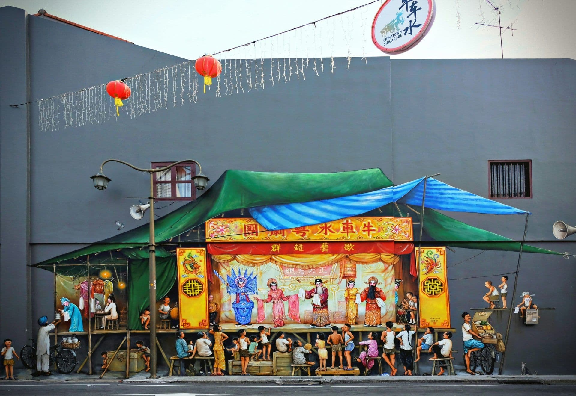 Vibrant mural depicting a traditional Chinese opera and street life in Chinatown, Singapore