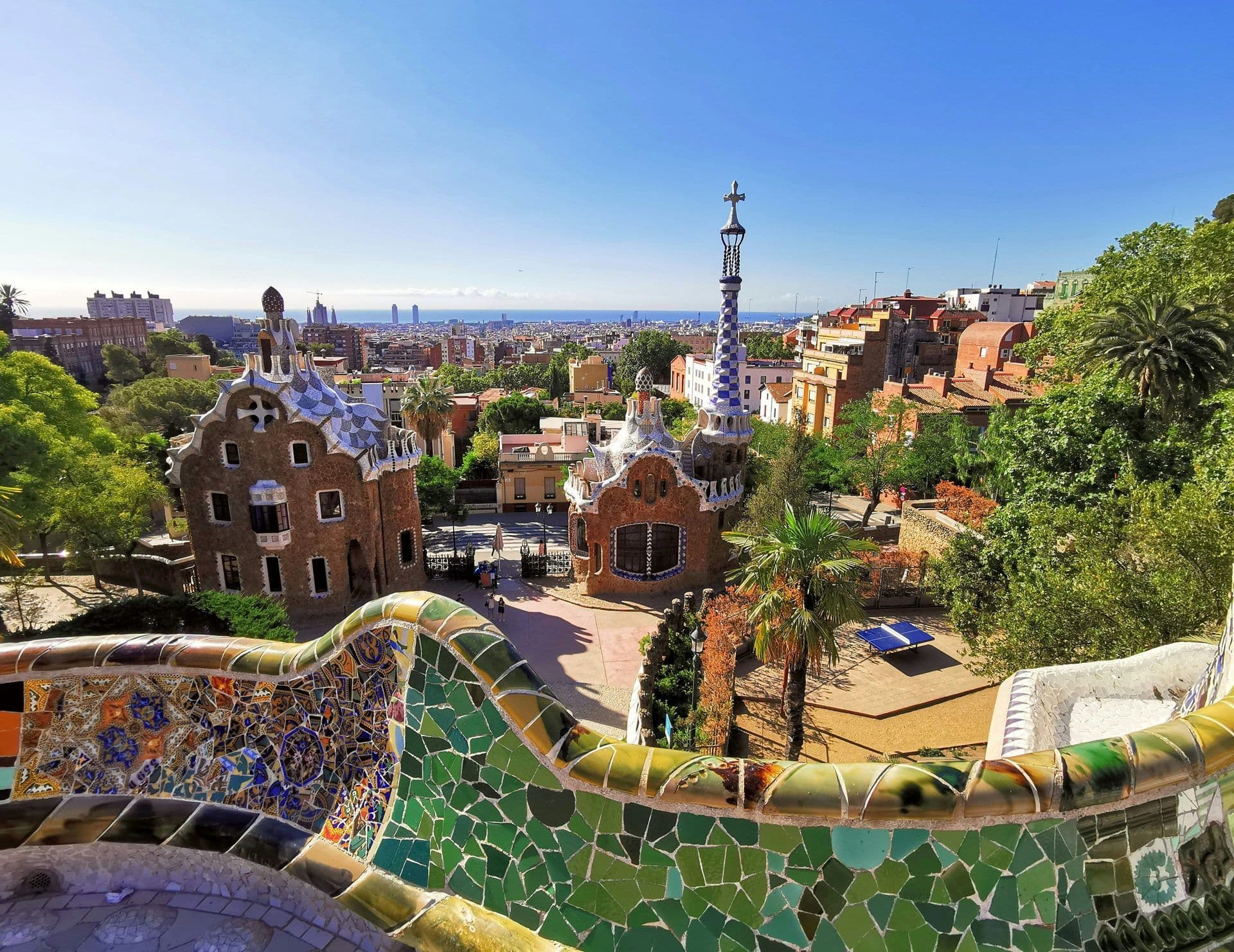 Park Güell, a unique historic venue in Barcelona, featuring mosaic art, Gaudi houses, and city views.