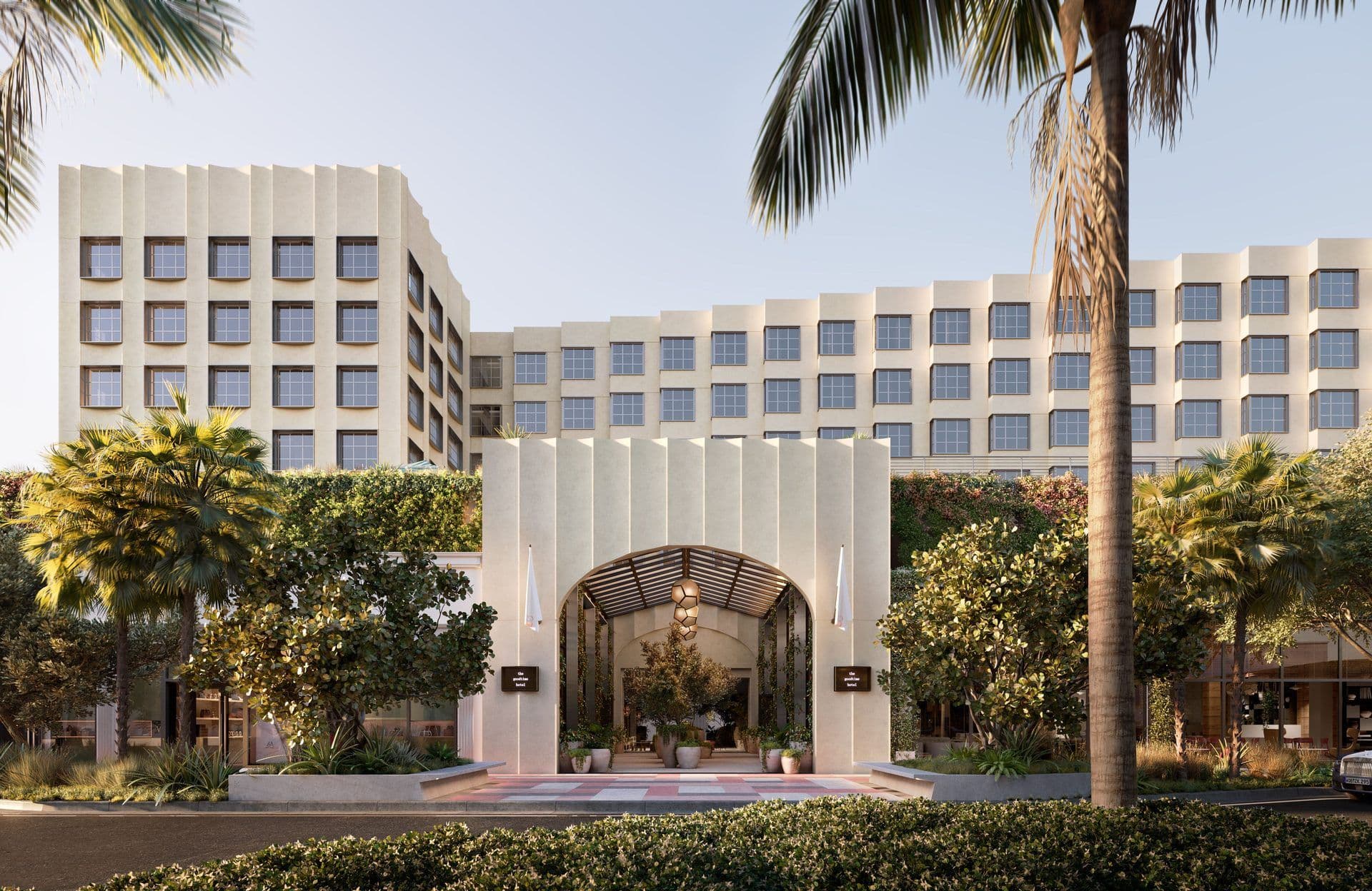 The Goodtime Hotel exterior, a stylish corporate event venue with unique architecture and lush palm trees.