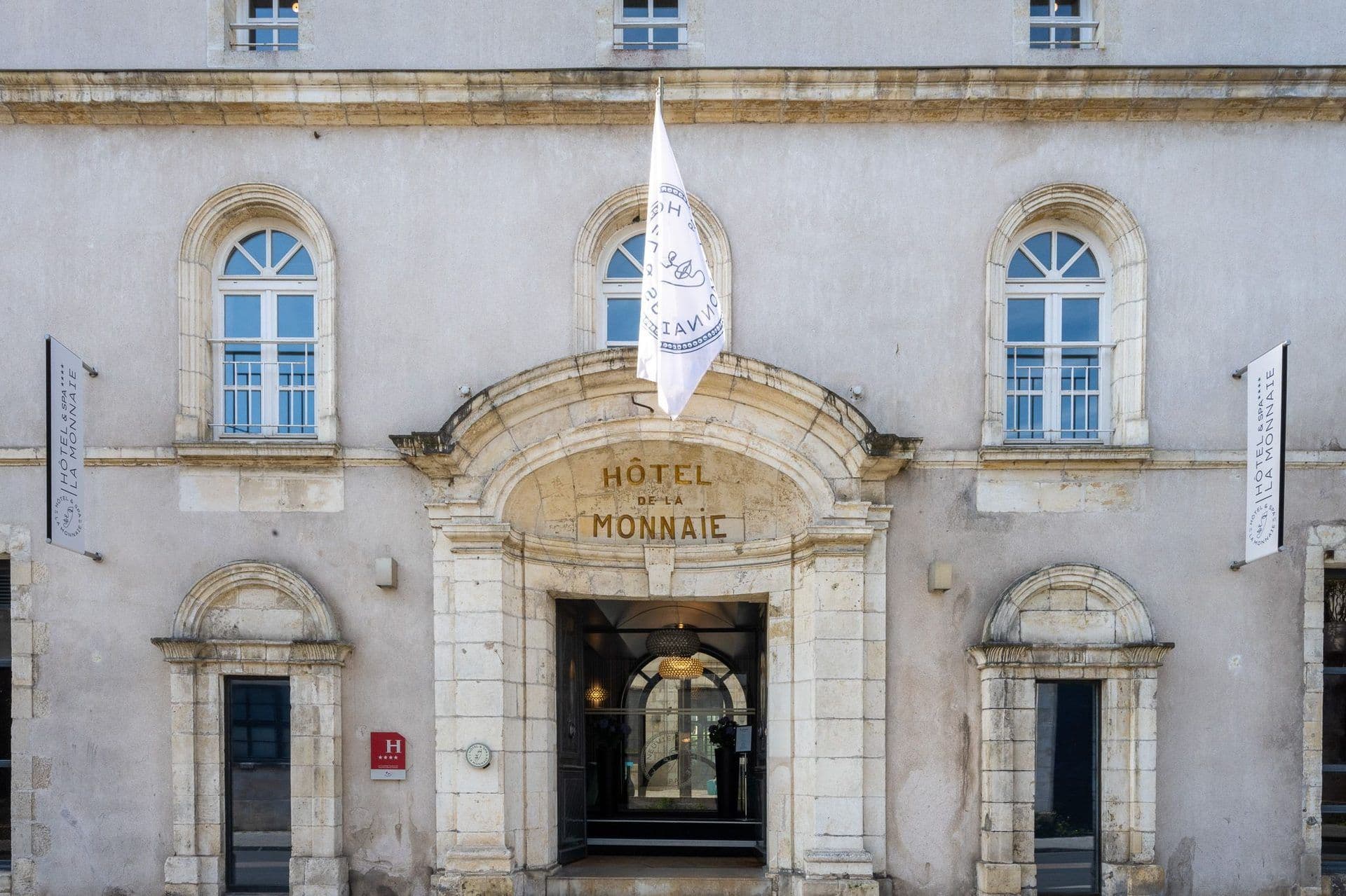 The historic stone facade of Hôtel de la Monnaie, a 4-star corporate event venue in La Rochelle.