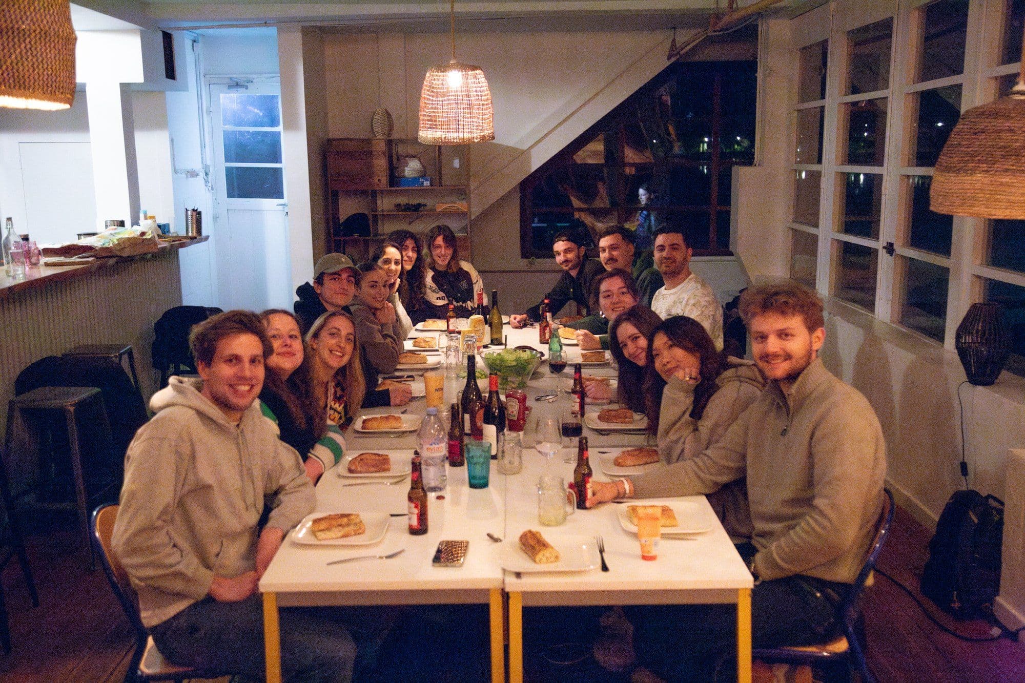 Naboo team gathered around a long dinner table after a team building evening