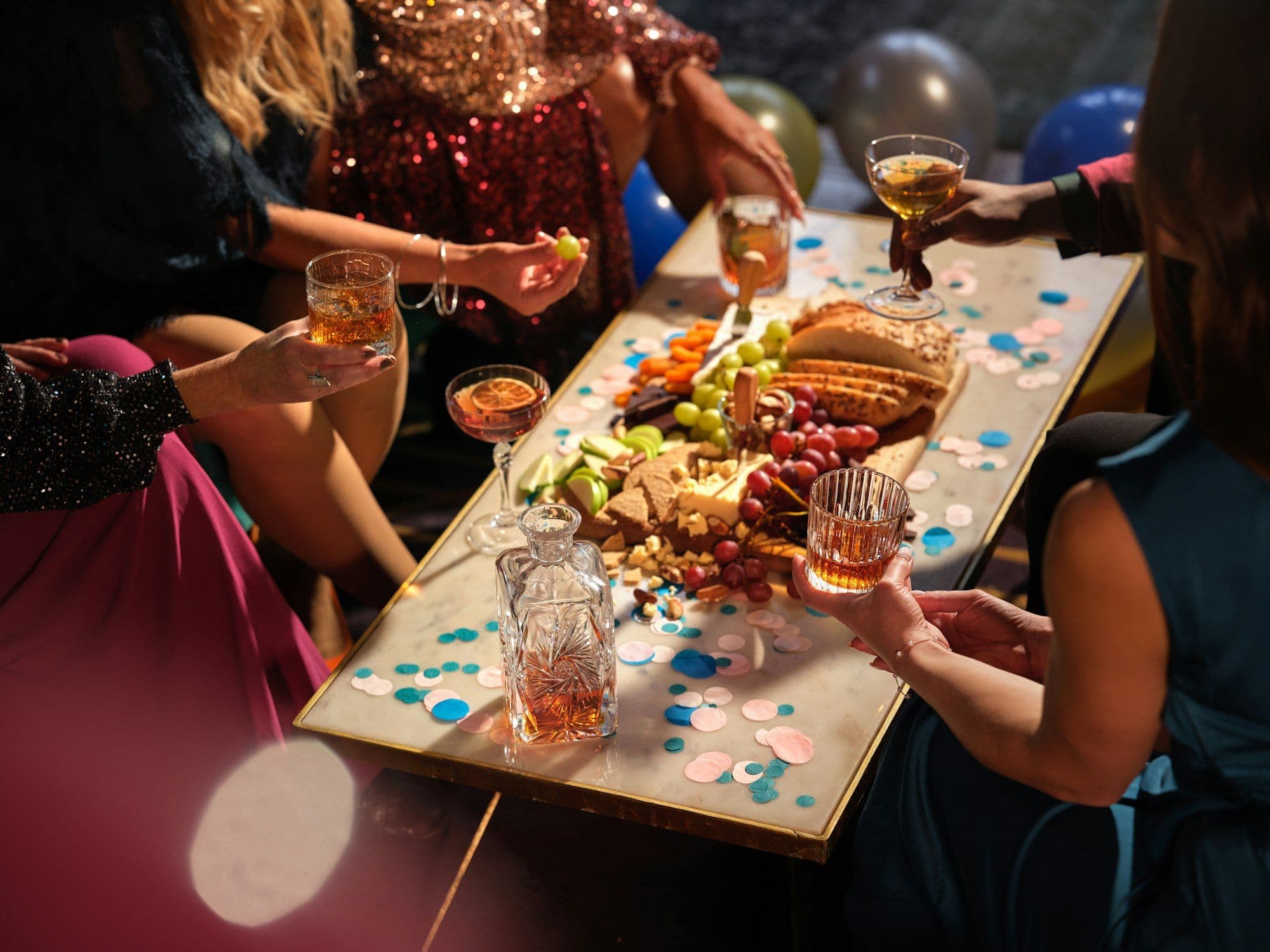 Colleagues sharing food and drinks at a company Christmas lunch