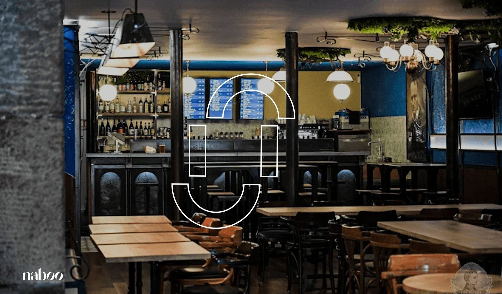 Interior of a vibrant privatised restaurant with wooden tables, chairs, and a bar, ideal for corporate events.
