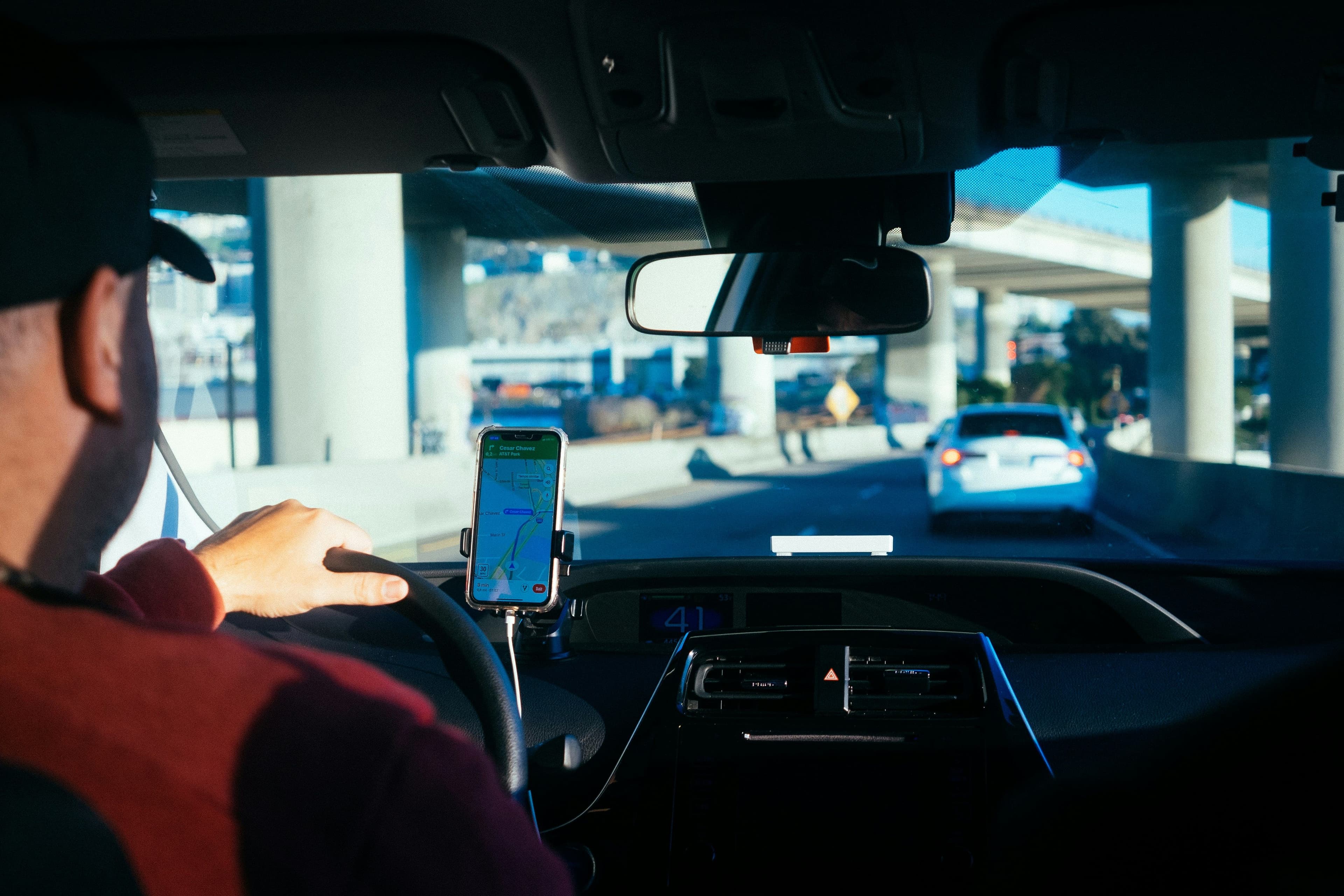 Shuttle driver following GPS navigation near an airport