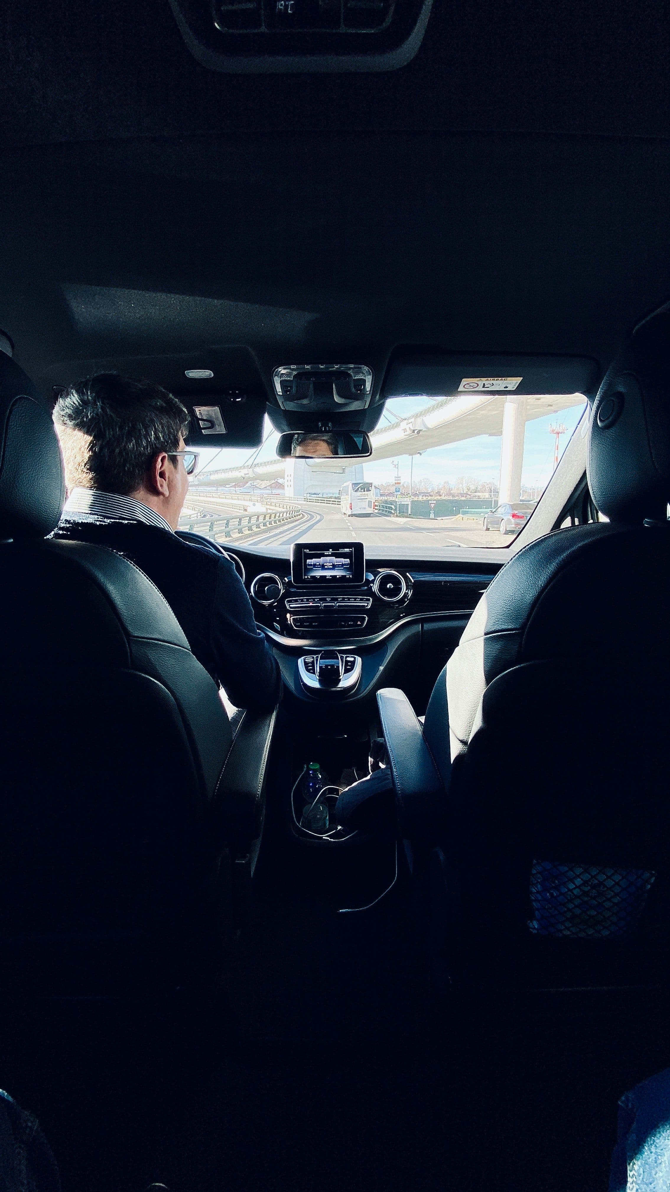 Chauffeur driving an executive Mercedes V-Class van